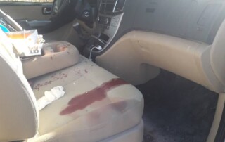 The bloody passenger seat in the damaged rescue vehicle.