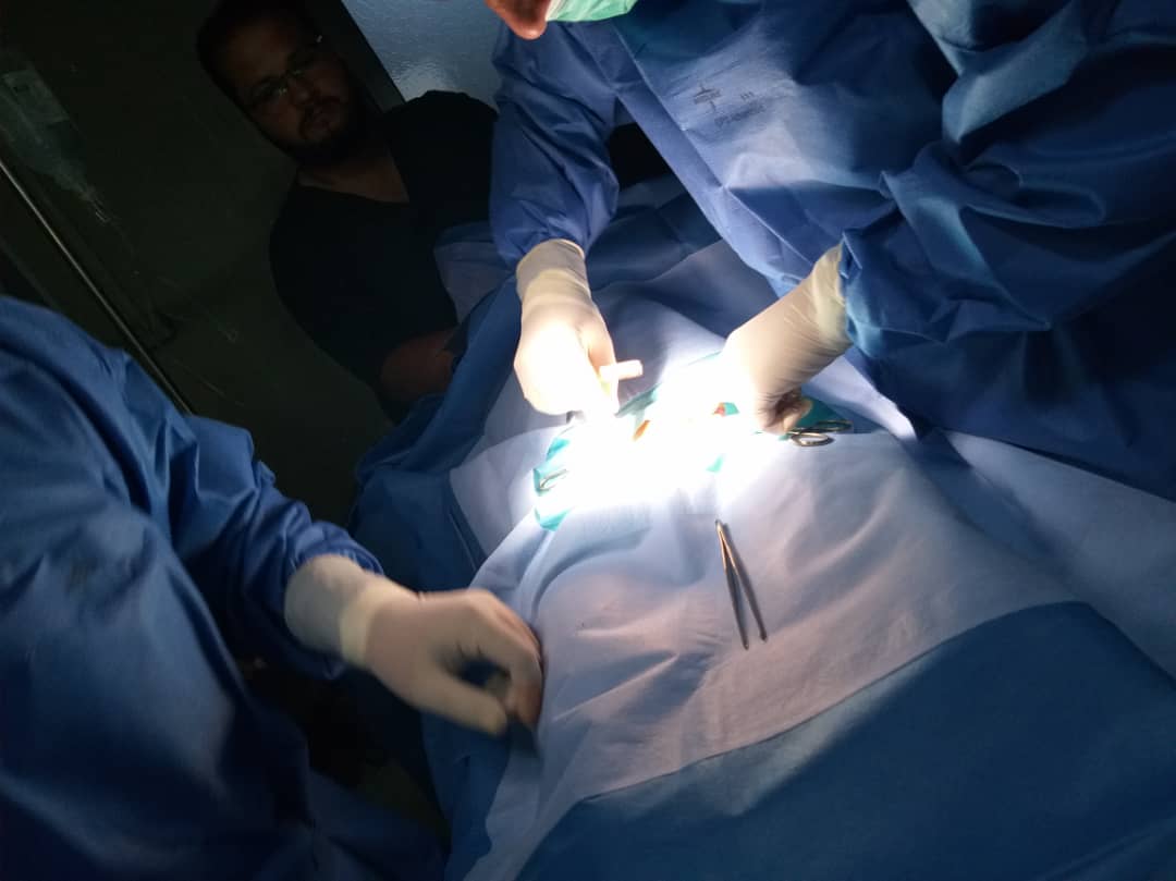 A surgery on the stomach is performed at al-Hawl field hospital.