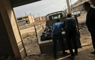 A truck is loaded with food supplies for distribution.