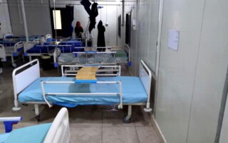 Two women cleaning the patient room of the field hospital at al-Hawl thoroughly as measure against the Corona virus.